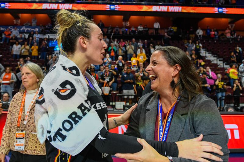 Connecticut Sun guard Marina Mabrey (4) and Connecticut Sun President Jennifer Rizzotti embrace