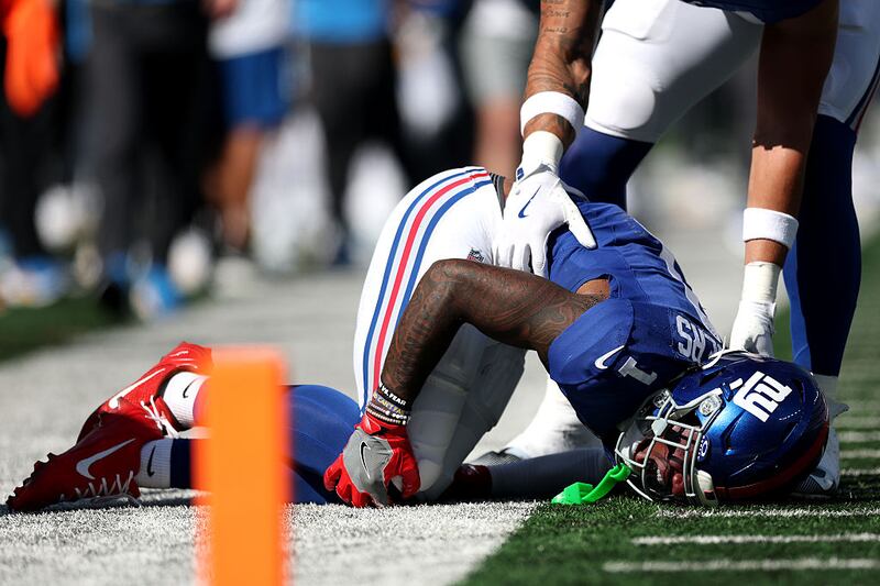 Malik Nabers #1 of the New York Giants reacts after being injured against the Los Angeles Chargers during the second quarter in the game at MetLife Stadium