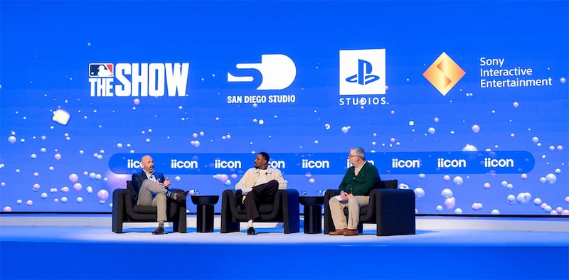MLB's Peter Hill (l) and Sony's Ramone Russell (c) discuss The Show's history and its future at the ESA's recent iicon conference.