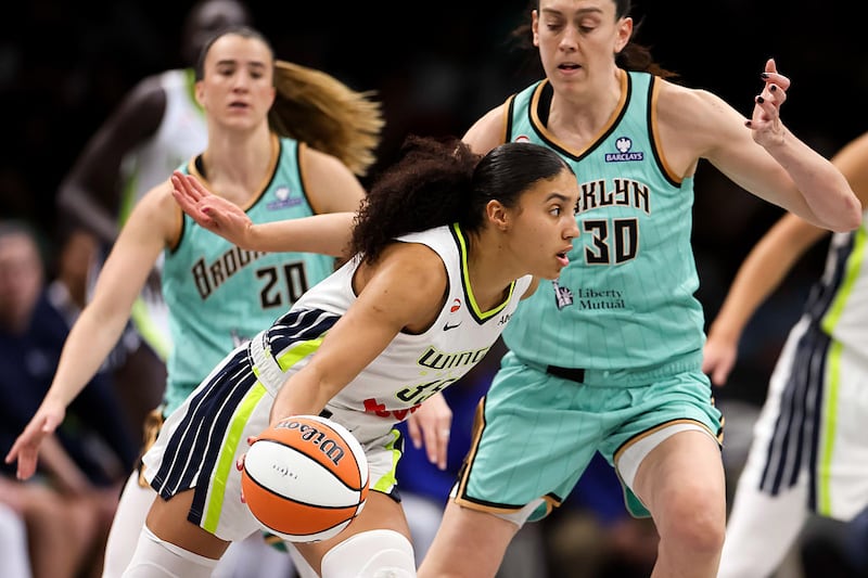 Azzi Fudd #35 of the Dallas Wings drives towards the basket against Breanna Stewart #30 and Sabrina Ionescu #20 of the New York Liberty
