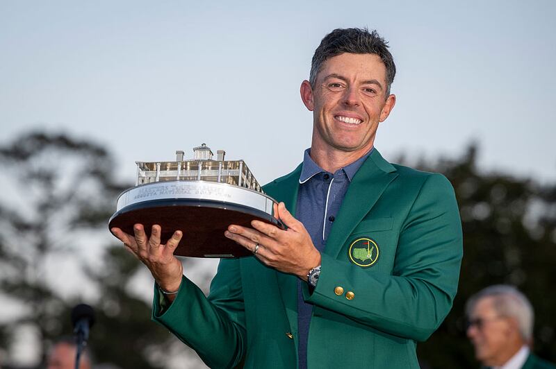 Masters champion Rory McIlroy of Northern Ireland holds the Masters trophy during the Green Jacket Presentation Ceremony