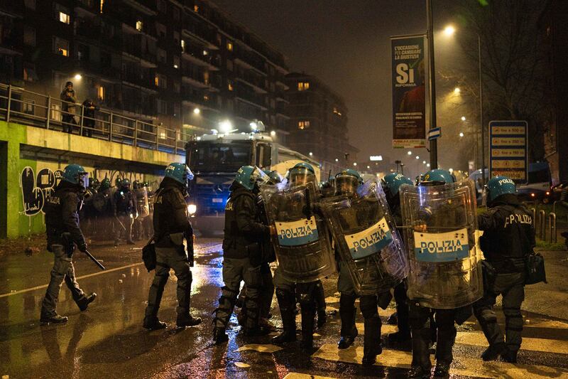 MILAN, ITALY - FEBRUARY 07: Police use water cannons and tear gas to drive away protesters during a protest over the Milan Cortina 2026 Olympics on February 07, 2026 in Milan, Italy. People marched through Milan in protest against a range of issues over the Milano Cortina 2026 Winter Olympic games, a day after the opening ceremony. (Photo by Alessandro Levati/Getty Images)