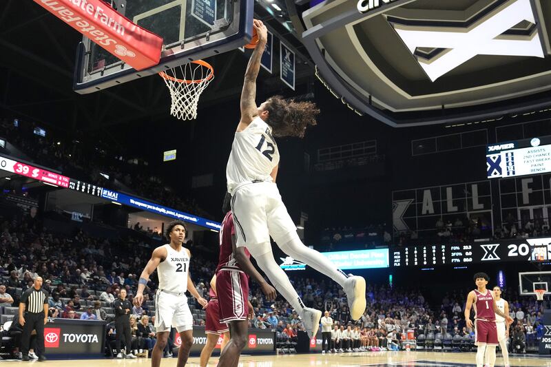CINCINNATI, OHIO - NOVEMBER 10: Tre Carroll #12 of the Xavier Musketeers dunks the ball during a college basketball game against the Santa Clara Broncos at the Cintas Center on November 10, 2025 in Cincinnati, Ohio. (Photo by Mitchell Layton/Getty Images)