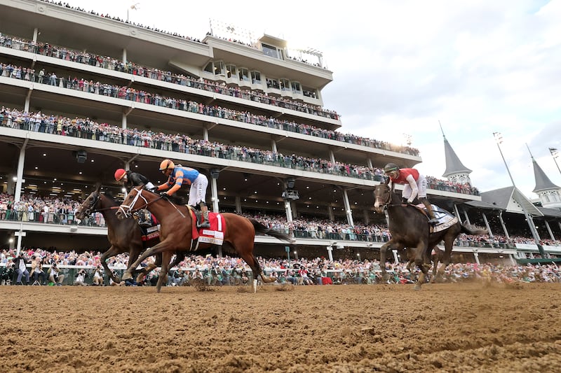 LOUISVILLE, KENTUCKY - MAY 02: Golden Tempo #19, ridden by jockey Jose Ortiz, celebrates with Renegade #1, ridden by jockey Irad Ortiz Jr., after cross the finish line to win the 152nd running of the Kentucky Derby at Churchill Downs on May 02, 2026 in Louisville, Kentucky. (Photo by Michael Reaves/Getty Images)