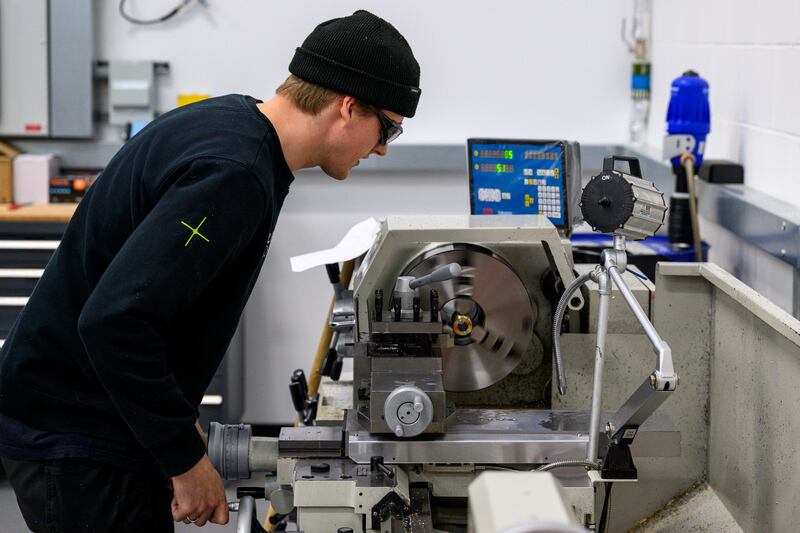 Isaac Venn of SailGP Technologies working on the lathe at the SailGP Technologies facility, Southampton, UK Friday 7 March 2025. Photo: Jason Ludlow for SailGP. Handout image supplied by SailGP