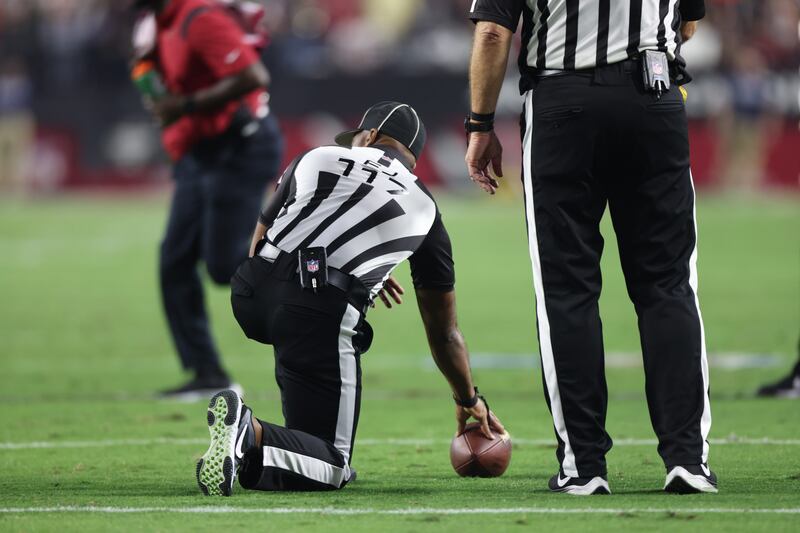 Field judge John Jenkins (117) spots the ball during an NFL football game between the Arizona Cardinals and the Green Bay Packers, Thursday, Oct. 28, 2021, in Glendale, Ariz. (Photo by Tom Hauck/Getty Images)