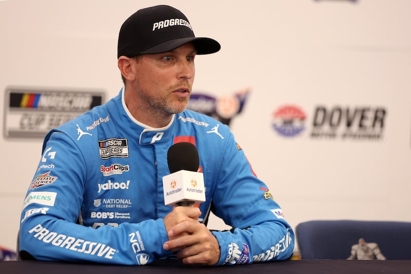 DOVER, DELAWARE - JULY 19: Denny Hamlin, driver of the #11 Progressive Toyota, speaks to the media during a press conference during practice for the NASCAR Cup Series AutoTrader EchoPark Automotive 400 at Dover Motor Speedway on July 19, 2025 in Dover, Delaware. (Photo by Meg Oliphant/Getty Images)