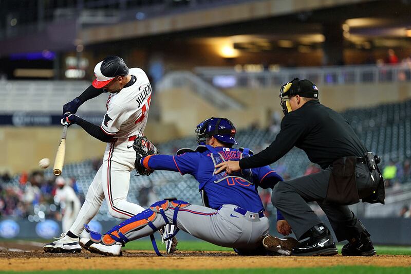 Edouard Julien #47 of the Minnesota Twins hits a single against the New York Mets in the fifth inning at Target Field