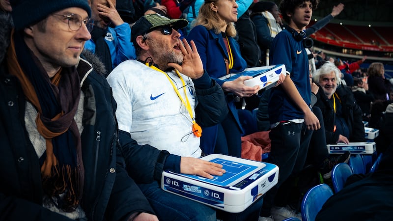 Touch2See being used by fans at a soccer game.
