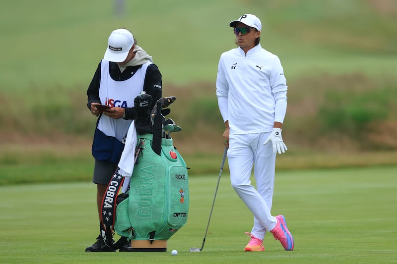 SOUTHAMPTON, NEW YORK - JUNE 18: Rickie Fowler of the United States looks on with his caddie on the 1st hole during the first round of the 126th U.S. OPEN at Shinnecock Hills Golf Club on June 18, 2026 in Southampton, New York. (Photo by David Cannon/Getty Images)