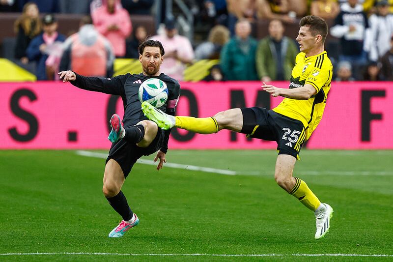 Lionel Messi #10 of Inter Miami CF battles for the ball with Sean Zawadzki #25 of Columbus Crew during a game between Inter Miami CF and Columbus Crew